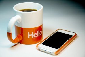 coffee mug and iPhone